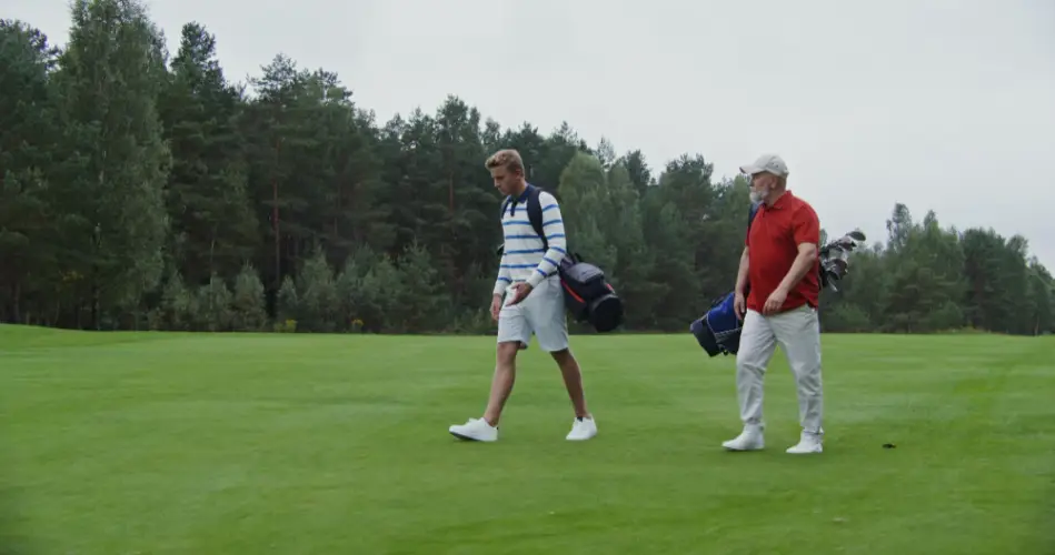 two-men-walking-on-golf-course.jpg