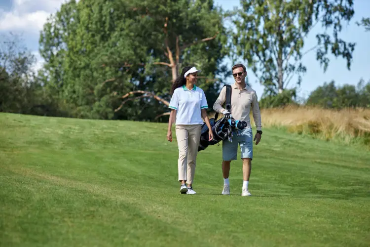couple-walking-golf-course-together.jpg