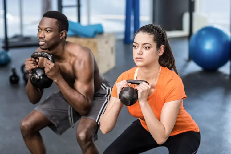 athletic-man-woman-working-out-gym.jpg