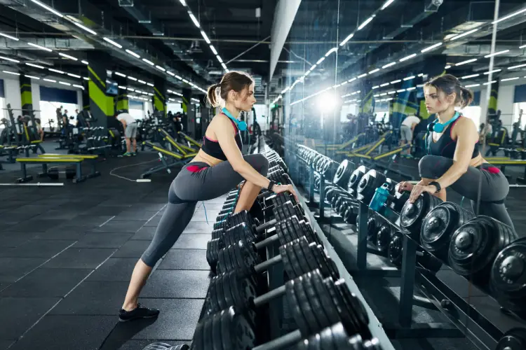 woman-stretching-gym-mirror.jpg