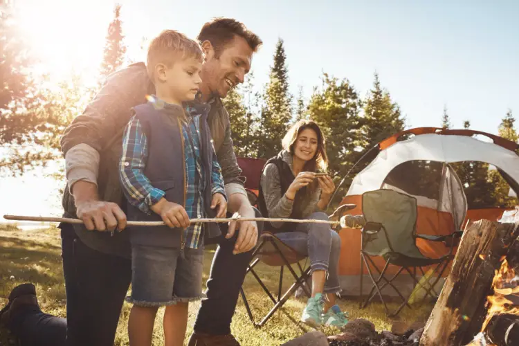 family-enjoying-campfire-at-campsite.jpg