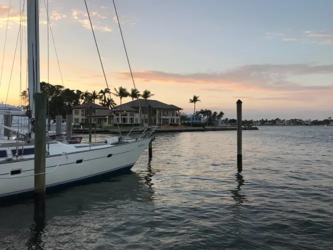 sailboat-docked-near-waterfront-villa.jpg