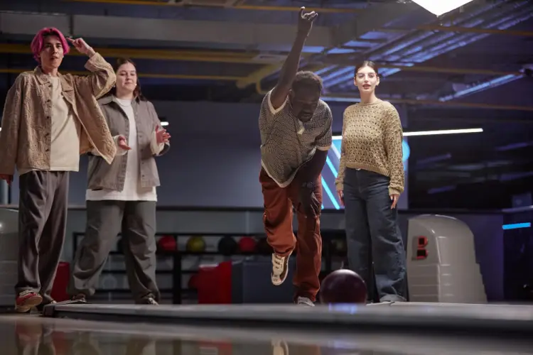 man-bowling-with-friends-watching.jpg