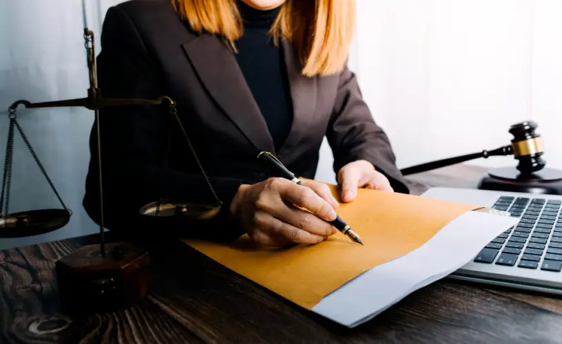 lawyer-signing-legal-contract-documents.jpg