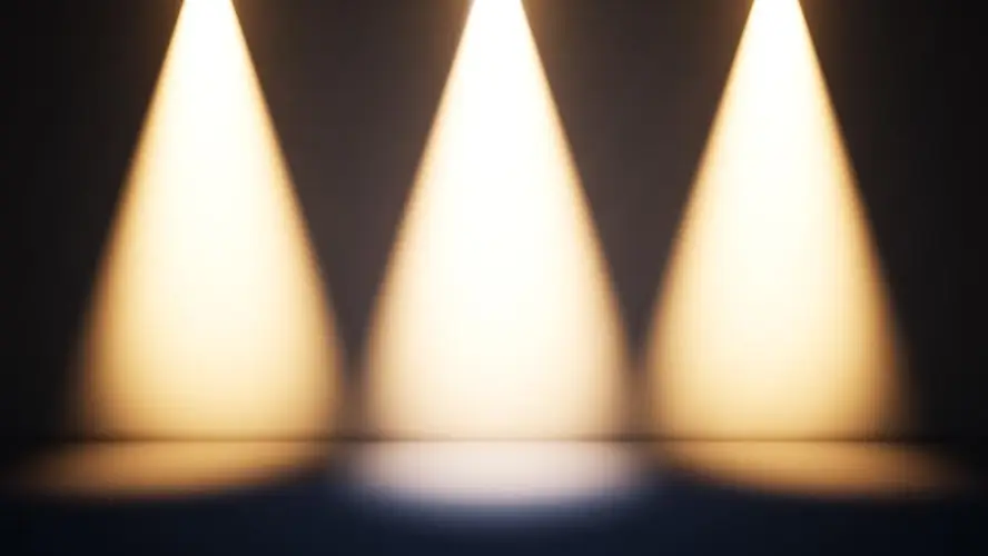 triple-spotlights-on-dark-performance-stage.jpg
