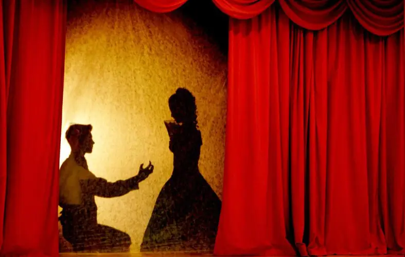 silhouette-theatre-scene-with-red-curtain.jpg