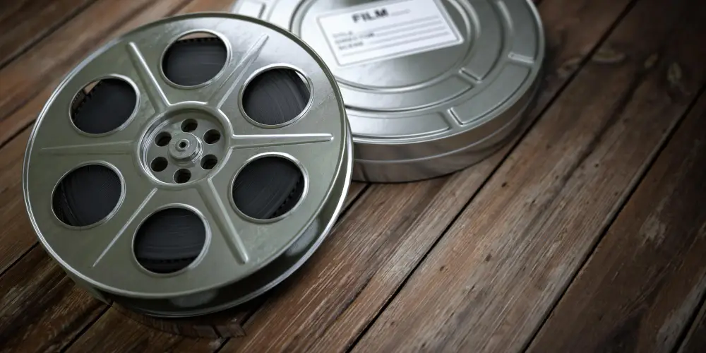 film-reel-and-canister-wooden-table.jpg