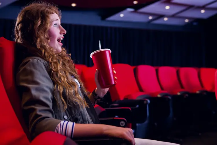 girl-drinking-soda-movie-theater.jpg