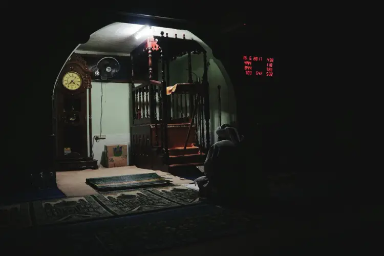 solitary-prayer-in-dark-mosque-interior.jpg
