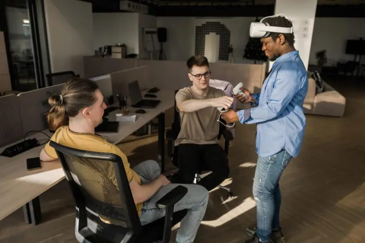 colleagues-testing-vr-device-in-office.jpg