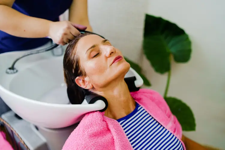 mature-woman-getting-hair-washed-in-salon.jpg