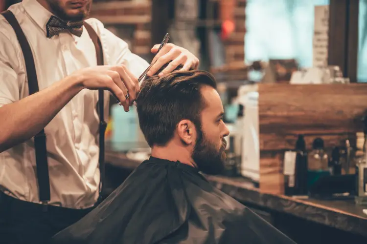 hipster-client-getting-haircut-suspenders-barber.jpg