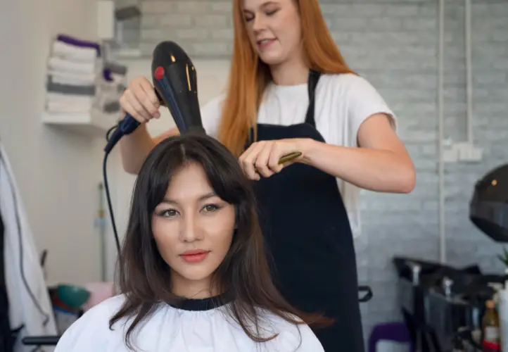 woman-getting-hair-styled-salon.jpg
