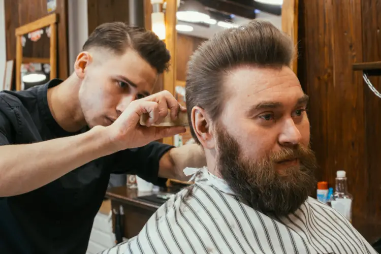 focused-barber-combing-hair.jpg