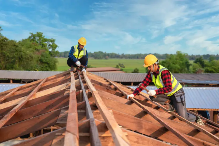 construction-workers-installing-wooden-roof-frame.jpg