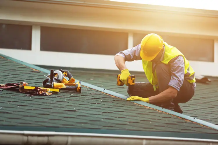 roofing-contractor-repairing-shingles-on-house.jpg