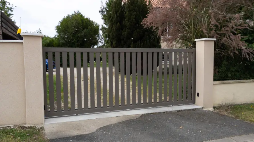 residential-iron-driveway-gate-with-fence.jpg