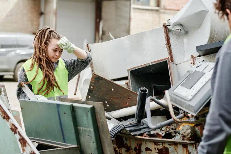 woman-checking-metal-scrap-outdoors.jpg