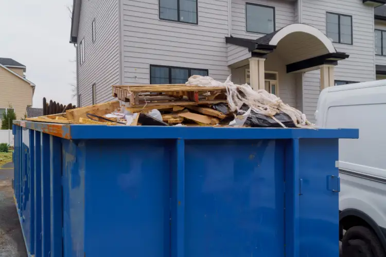 blue-dumpster-outside-house.jpg