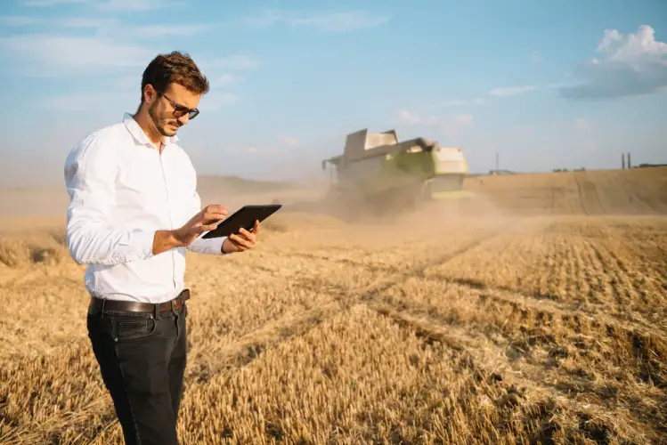 agronomist-using-tablet-in-harvested-wheat-field.jpg
