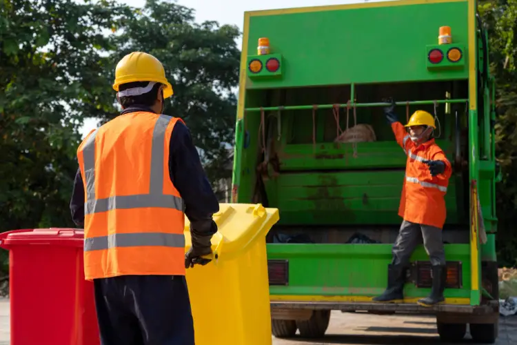 waste-collection-workers-loading-trash-truck.jpg