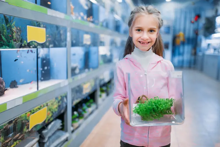 child-holding-aquarium-decor.jpg