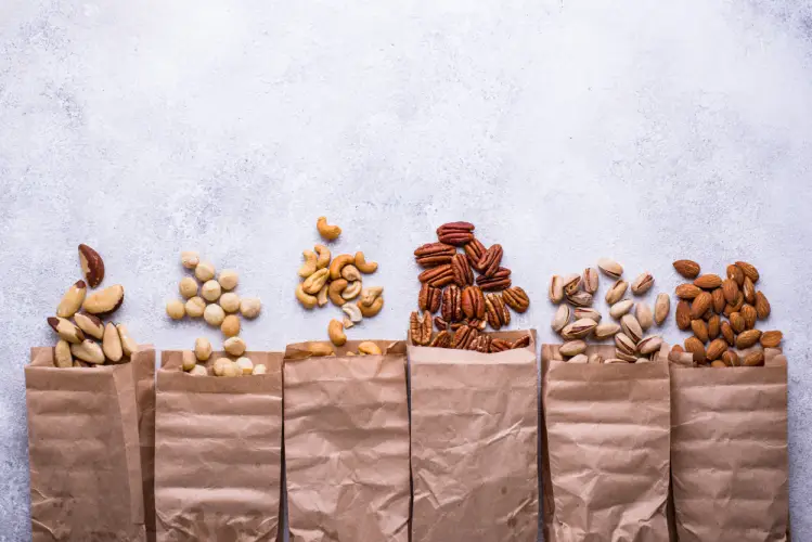 variety-of-nuts-in-paper-bags-on-light-background.jpg