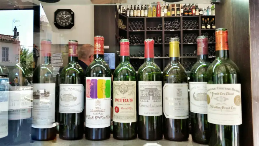wine-bottles-on-display-behind-glass.jpg