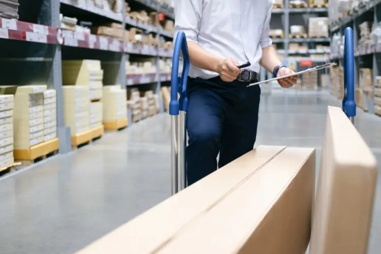 employee-checking-inventory-in-warehouse-store.jpg