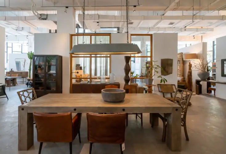 rustic-dining-table-and-chairs-in-modern-showroom.jpg