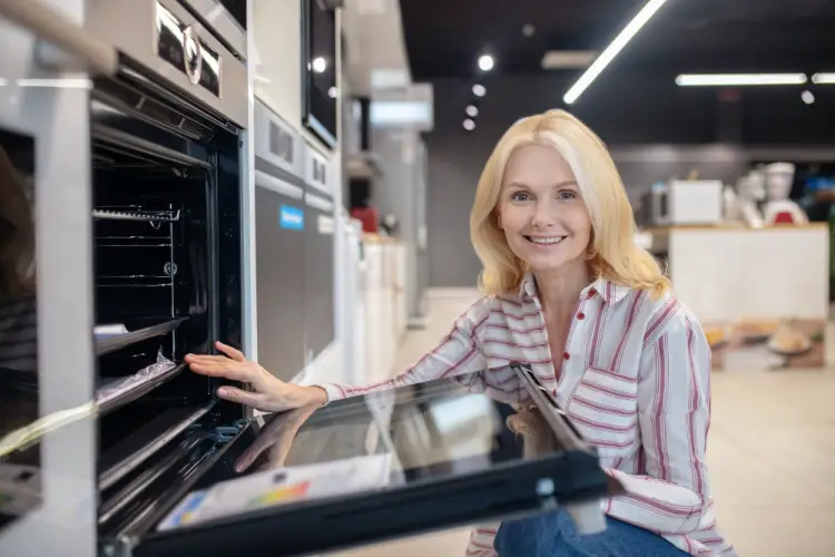 woman-shopping-for-built-in-oven-appliance-store.jpg