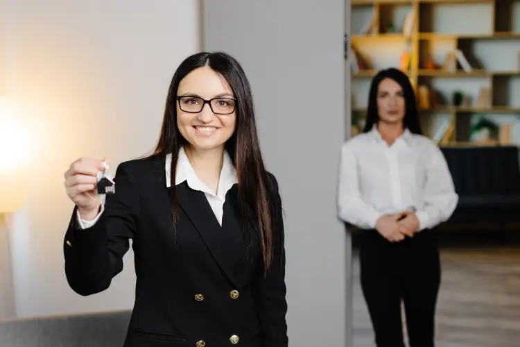 realtor-agent-is-realtor-with-keys-hand-against-background-real-estate-room-apartment-home.jpg