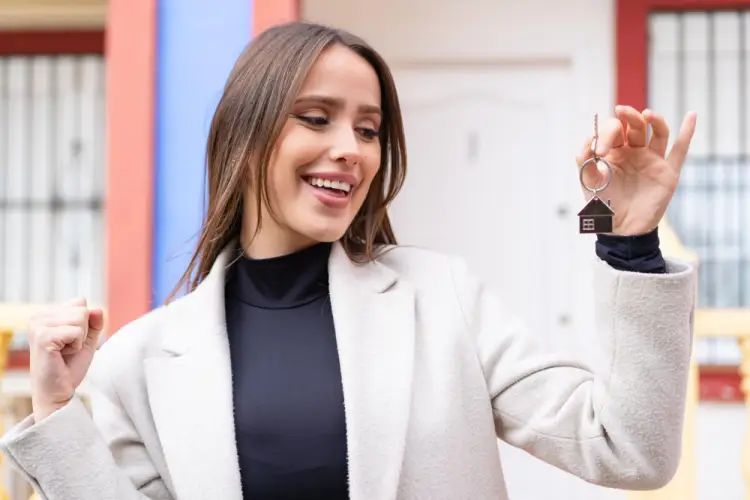 happy-woman-holding-house-keys-outdoors.jpg