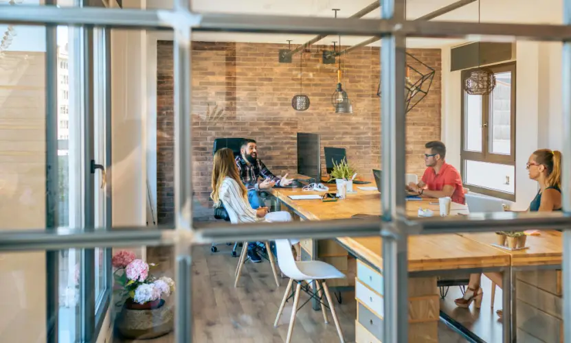 startup-team-meeting-in-glass-boardroom.jpg