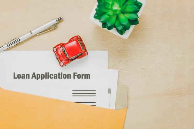 auto-loan-application-form-and-red-toy-car.jpg
