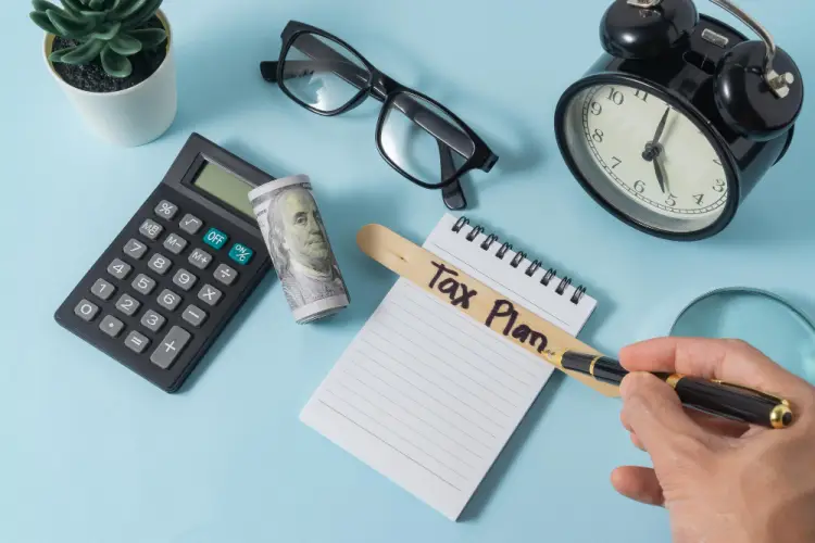 flatlay-tax-plan-clock-money-calculator.jpg