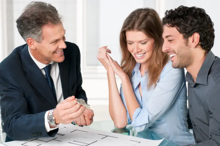 real-estate-agent-handing-keys.jpg