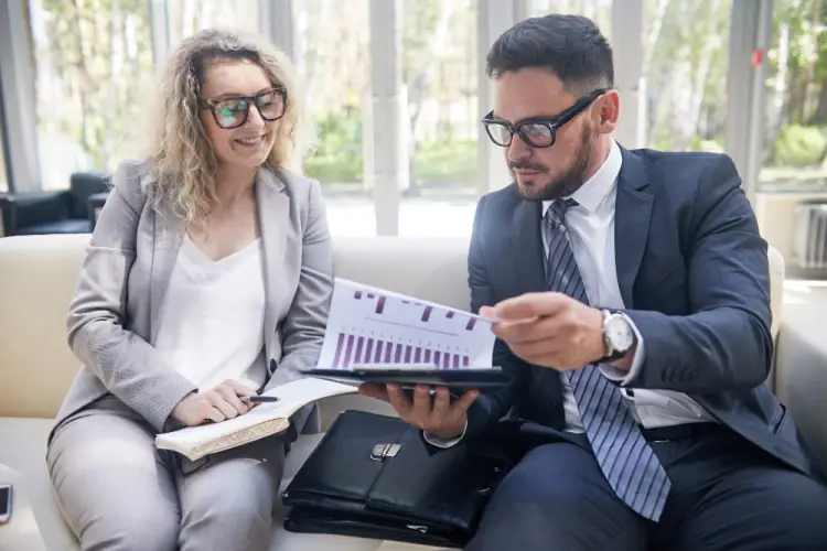 colleagues-reviewing-financial-report.jpg