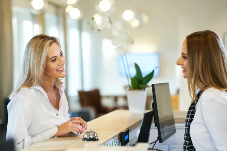 customer-speaking-to-hotel-receptionist.jpg