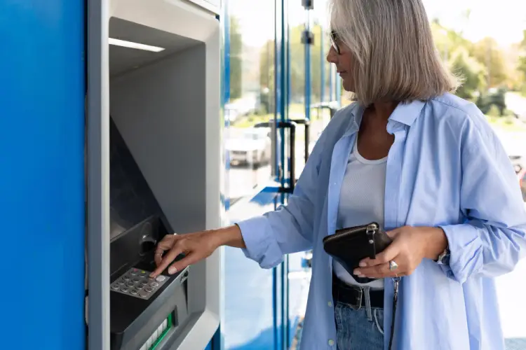 senior-woman-atm-transaction.jpg