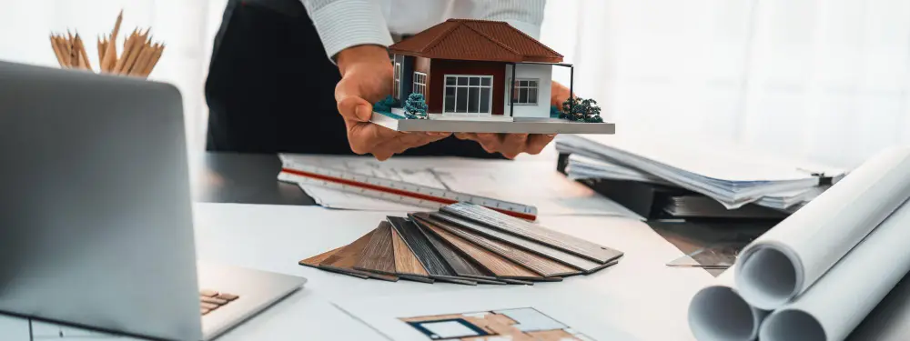 construction-engineers-holding-blueprints-hard-hats-outdoor.jpg