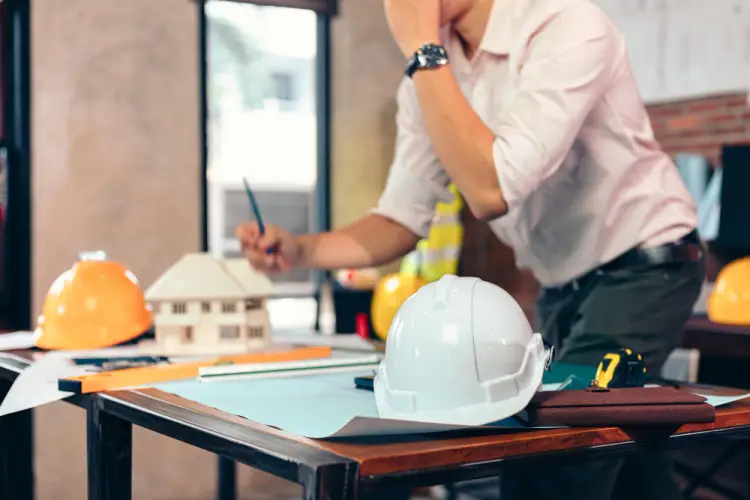 construction-engineering-project-plans-hard-hat-model-house.jpg