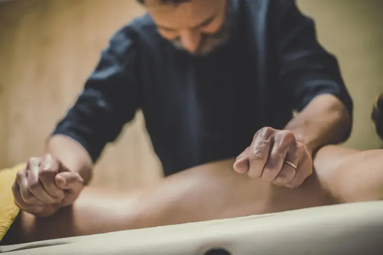 masseuse-massaging-legs.jpg