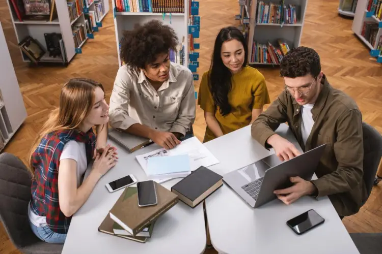diverse-group-studying-together-in-library.jpg
