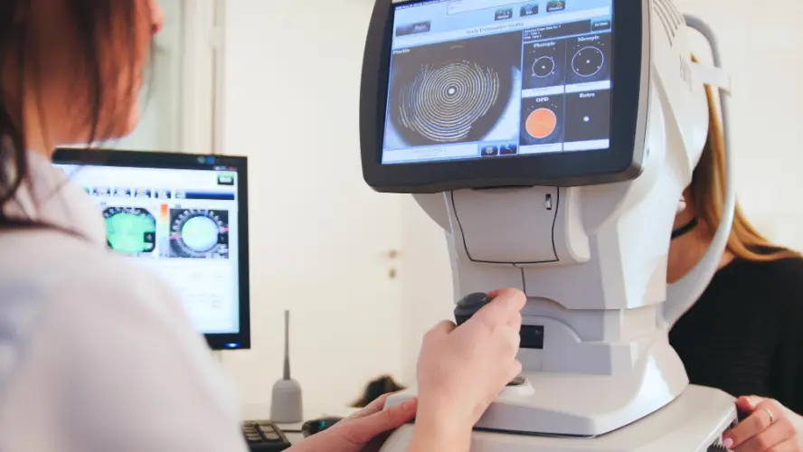 optometrist-operating-eye-scan-machine.jpg