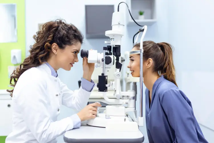 female-optometrist-performing-eye-exam.jpg