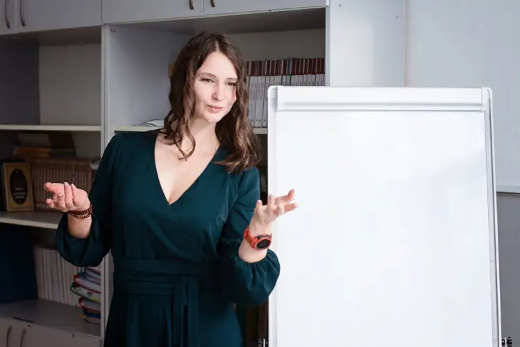 brunette-teacher-near-white-board.jpg