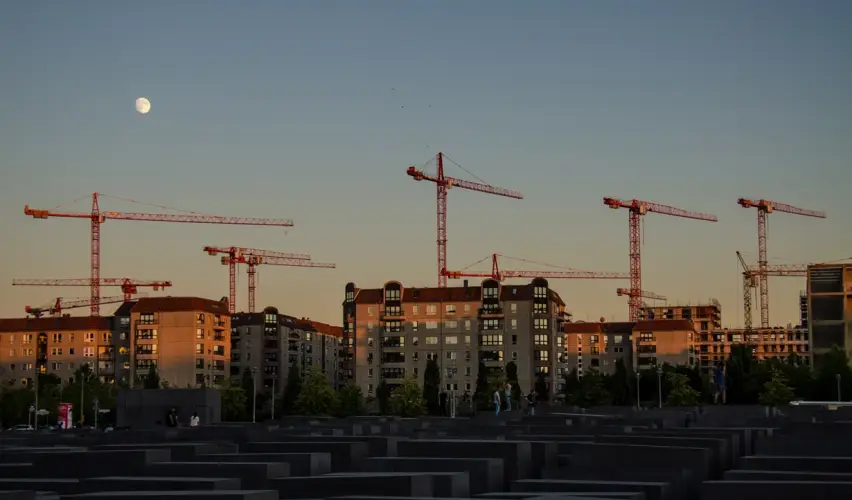 cranes-city-against-clear-sky-sunset.jpg