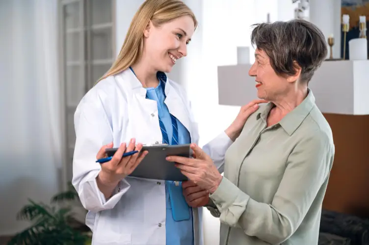 female-doctor-speaking-with-elderly-patient.jpg