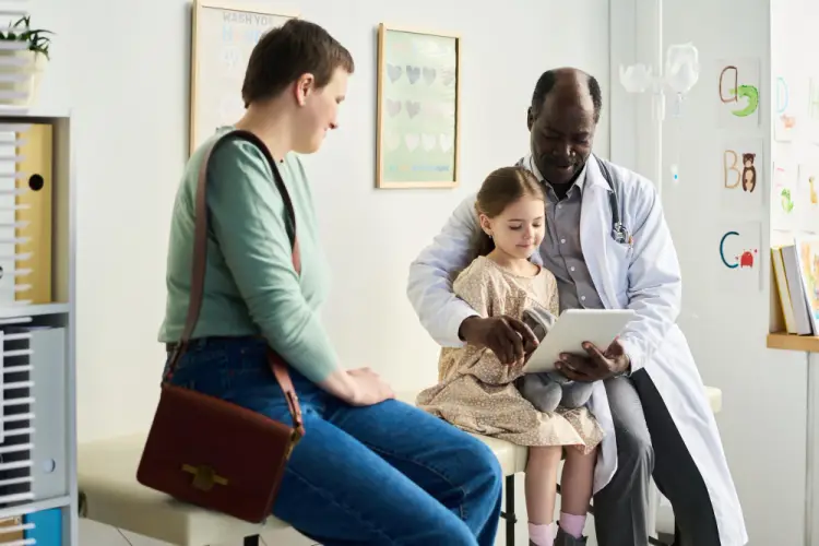 doctor-examining-child-with-mother.jpg